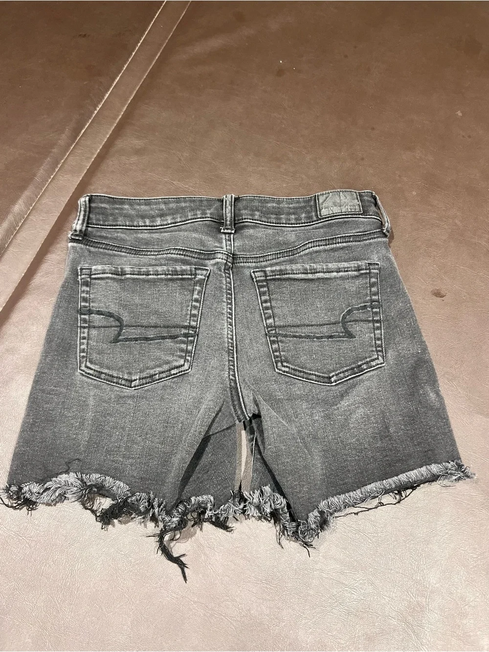 American Eagle Outfitters black denim shorts with button detail